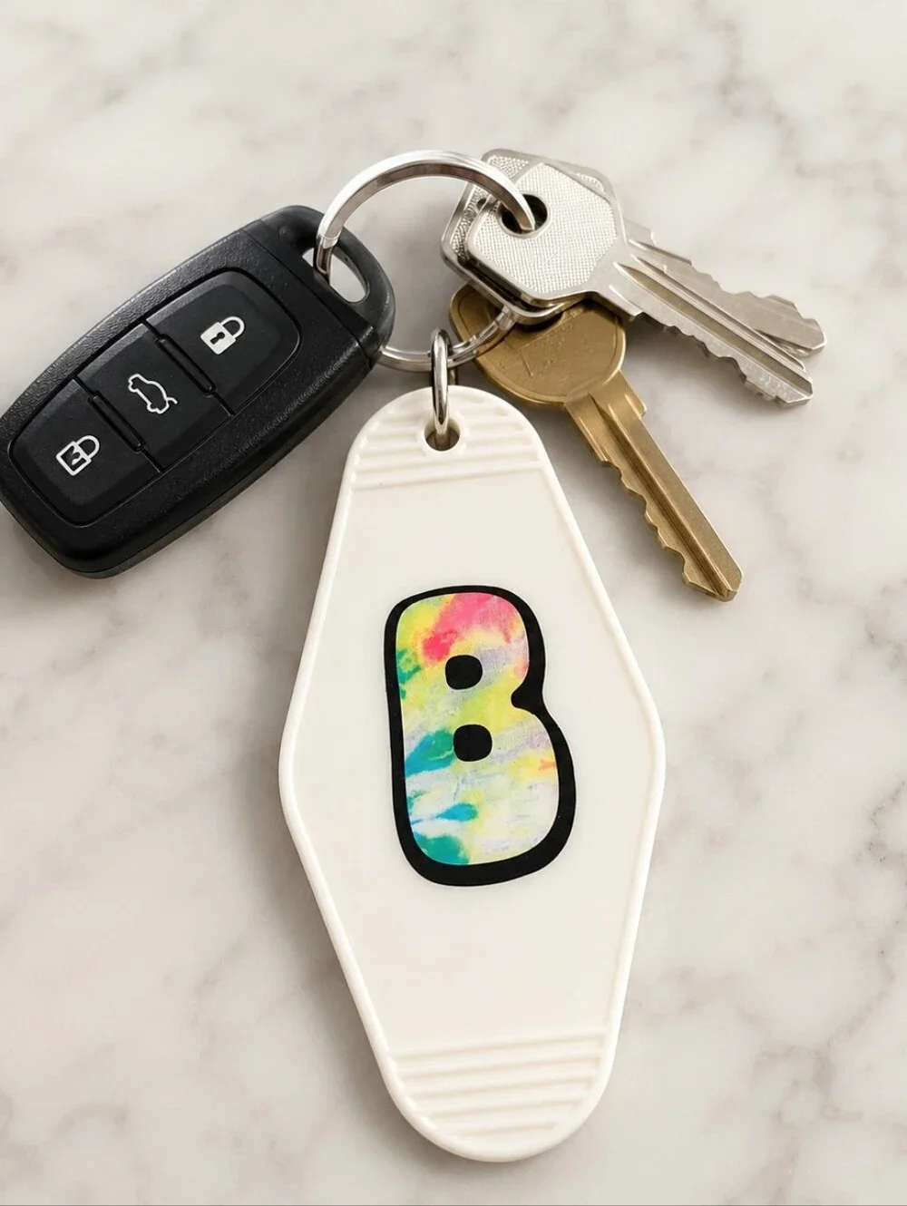 White Keychain Fob with Multicolor 'B' Accent